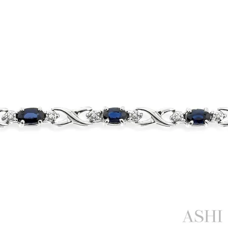 5x3 MM Oval Cut Sapphire and 1/10 Ctw Single Cut Diamond Bracelet in 10K White Gold