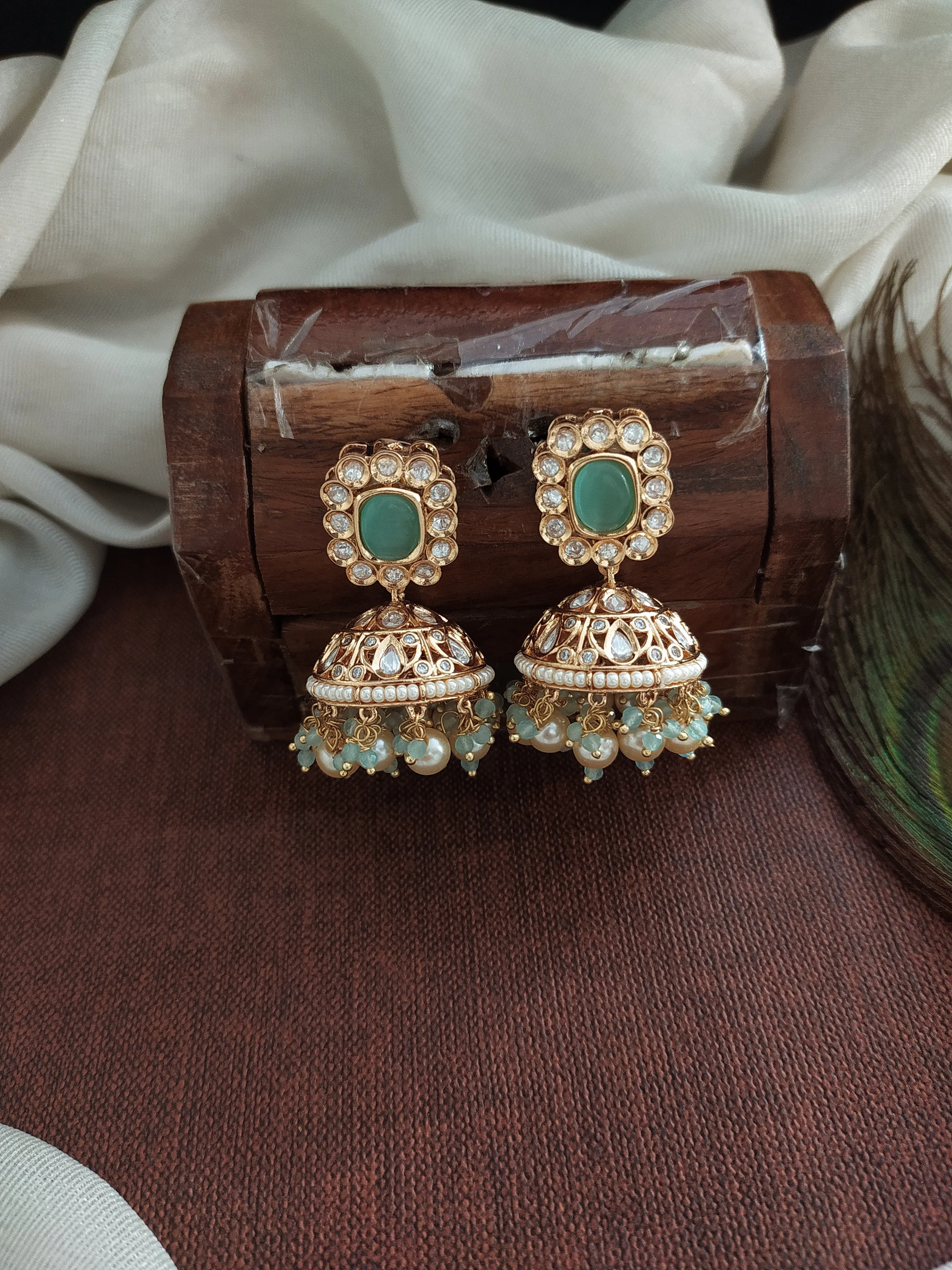 Elegant Kundan Jhumki in Green and Mint with White Stones